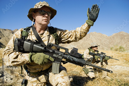 Photo: Soldier signalling during battle Soldier signalling during battle