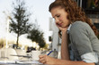 Businesswoman at Sidewalk Cafe