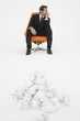 Pensive Businessman With Waste Paper
