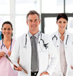 Senior Smiling doctor with his colleagues