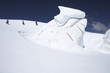 Mountain climbers walking past ice formation