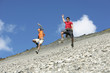 Two men jumping down screen field