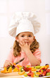 Little girl chief making fresh fruit salad Little girl chief making fresh fruit salad