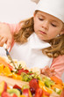 Little girl chef with lots of fruits Little girl chef with lots of fruits