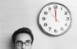 Foto: Anxious Businessman Looking at Office Clock Anxious Businessman Looking at Office Clock
