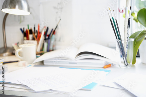 Photo: Artist's Desk with books, papers and brushes Artist's Desk with books, papers and brushes