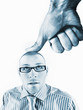 Photo: Office worker being bushed by large thumb Office worker being bushed by large thumb