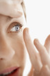Woman Inserting Contact Lens, close up of face