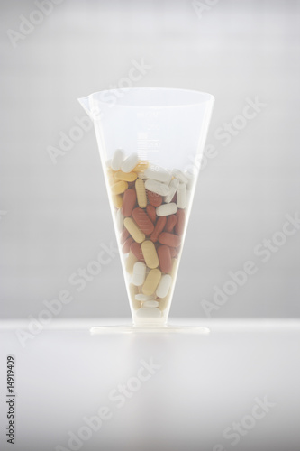 Photo: Pills in funnel Pills in funnel