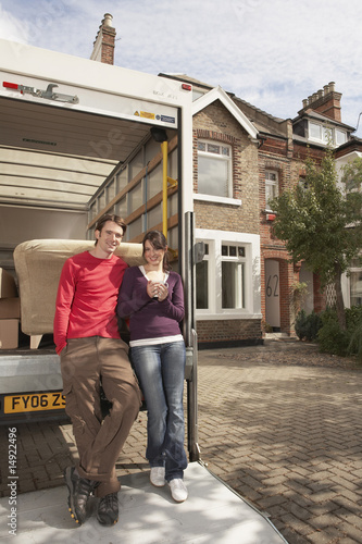 Photo: Couple Moving into New Home Couple Moving into New Home