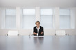 Business Executive Sitting in Boardroom