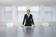 Business Executive Standing in Conference Room