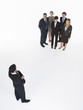 Foto: Businessman looking at group Businessman looking at group