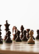 Chess game, one white piece in front of black pieces