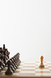 Chess game, single white piece in front of black pieces