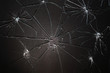 Broken glass pieced together on black background