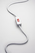 Switch on power cord, against white background in studio