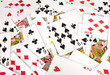 stack of assorted playing cards being shuffled