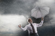 Businessman holding umbrella, Laughing in Storm, low angle view