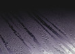 Water drops running through fog on Glass