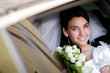 portrait of the bride in the wedding car