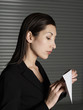 Young elegant woman opening letter