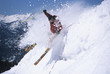 Skier skiing through powdery snow on ski Slope