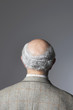 Senior Man in studio, head and shoulders, back view