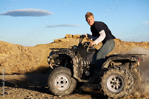 Photo: quad - teen driving four wheeler ATV quad - teen driving four wheeler ATV