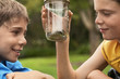 Boys Looking at Snake in Jar