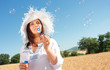 Girl blowing soap bubbles