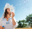 Girl blowing soap bubbles