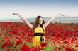 Smiling girl in the poppy field