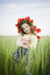 Smiling little girl in floral wreath