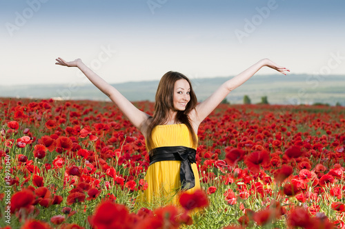 Photo: Smiling girl in the poppy field Smiling girl in the poppy field