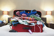 Open suitcase on bed