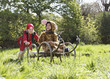 Photo: Young boy 7-9 in pirate costume pushing boy 5-6 in cart in jaguar costume, smiling Young boy 7-9 in pirate costume pushing boy 5-6 in cart in jaguar costume, smiling