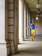 Foto: Soccer player kicking ball in portico Soccer player kicking ball in portico