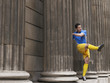 Foto: Soccer player kicking ball, standing between columns Soccer player kicking ball, standing between columns