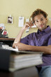 Young man using mobile phone in office