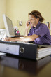 Young man using mobile phone in office