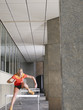 Woman jumping hurdles outside building