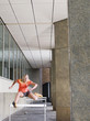 Woman jumping hurdles outside building