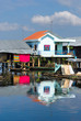 Modern and old  House on the river,  Cambodia.