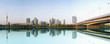 View on a modern city with a water reflection View on a modern city with a water reflection