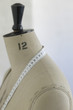 Mannequin indoors, close up, side view