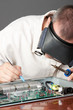 Engineer repairing circuit board