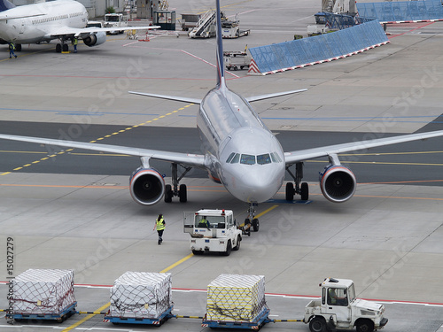 Aircraft getting moved to taxiway