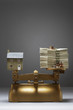 Model house and money on scales