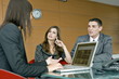 Professional woman meeting with couple
